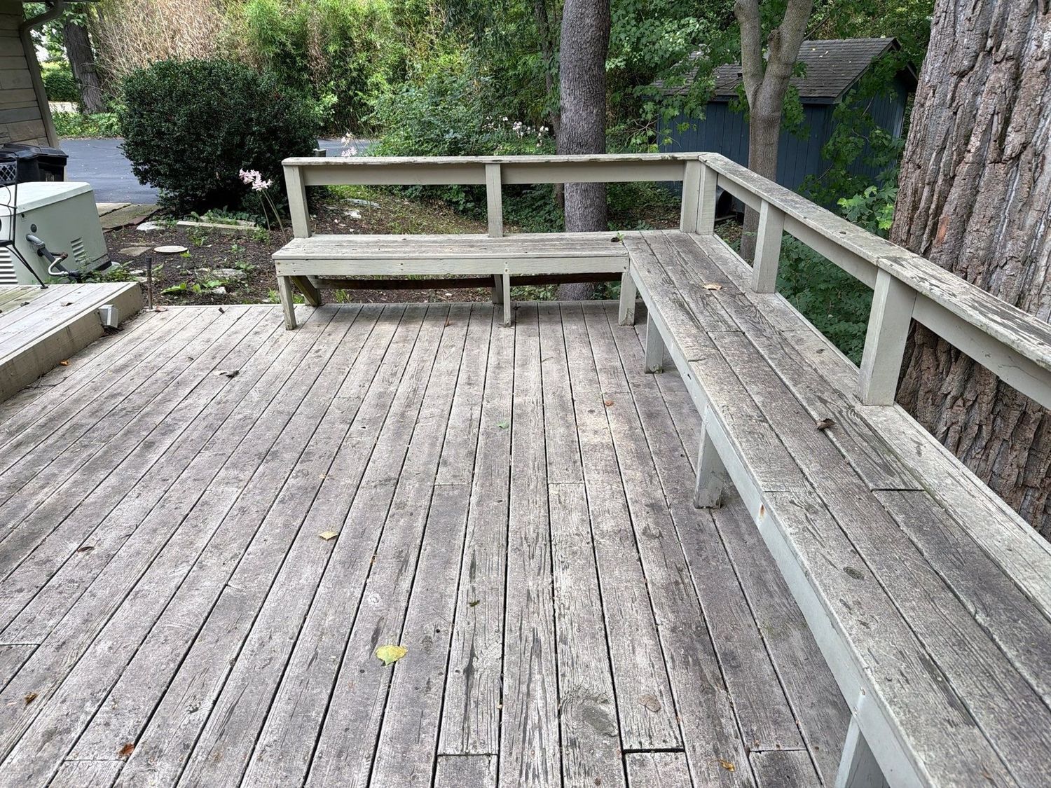 Weathered wood deck and rail at an Anderson home before cleaning