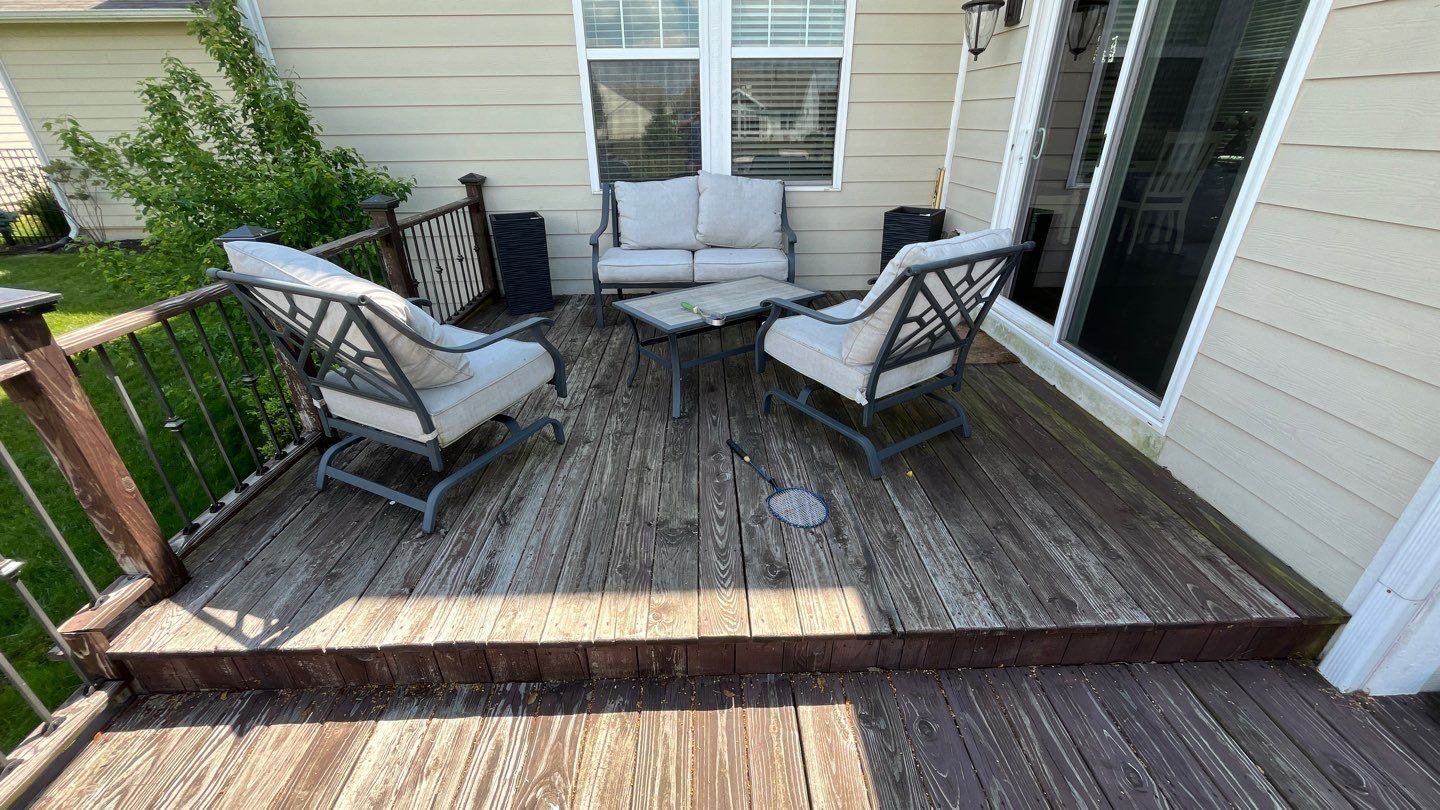 Cleaned wood deck with seating at a Fishers home