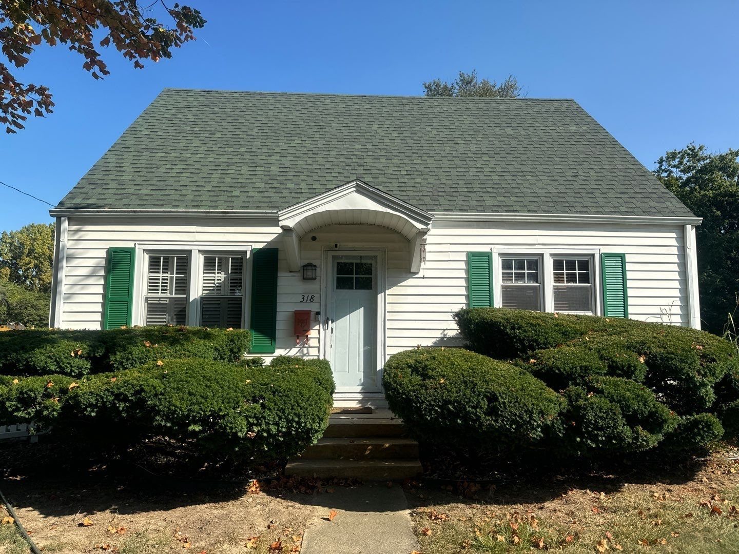 Indiana home with clean siding, roof and drive after an exterior wash